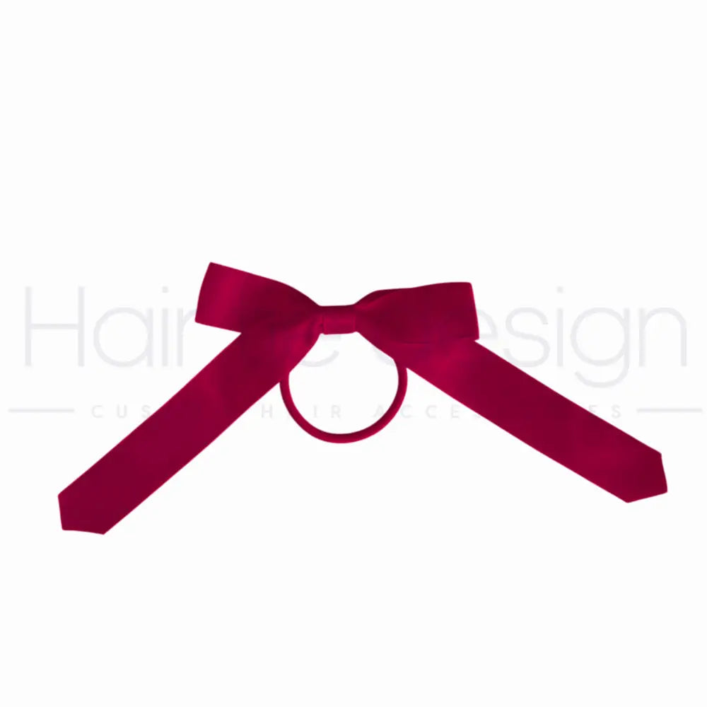 A deep magenta satin bow with a central loop, shown on a plain white background.